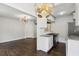 Open-concept featuring hardwood floors, leading to a modern kitchen and living room at 1072 Piedmont Ne Ave # 101, Atlanta, GA 30309