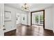 Bright living room showcasing hardwood floors, stylish lighting, and an inviting transition to an outdoor view at 1072 Piedmont Ne Ave # 101, Atlanta, GA 30309