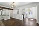 Open floor plan showcasing hardwood floors, staircase and views into the kitchen at 1072 Piedmont Ne Ave # 101, Atlanta, GA 30309