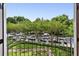Scenic view of tree-lined street from balcony showing neighborhood's charm at 1072 Piedmont Ne Ave # 101, Atlanta, GA 30309