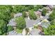 Aerial view of neighborhood with mature trees and landscaping at 1600 Heritage Trl, Roswell, GA 30075