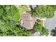 An aerial view of the home nestled among mature trees at 1600 Heritage Trl, Roswell, GA 30075