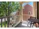 Cozy balcony featuring outdoor seating with a peaceful view of the surrounding greenery at 1600 Heritage Trl, Roswell, GA 30075