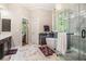 Elegant bathroom with modern fixtures, a glass shower, and a freestanding tub at 1600 Heritage Trl, Roswell, GA 30075