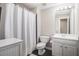 Full bathroom featuring shower/tub combo, toilet, sink and white vanity at 1600 Heritage Trl, Roswell, GA 30075