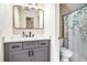 Bathroom featuring new vanity, mirror and shower with modern decor at 1600 Heritage Trl, Roswell, GA 30075