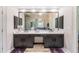 Stunning bathroom with double vanity, dark wood cabinets, and decorative lighting at 1600 Heritage Trl, Roswell, GA 30075
