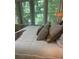 Relaxing bedroom with natural light, hardwood floors, and plush bedding and neutral accents at 1600 Heritage Trl, Roswell, GA 30075