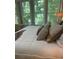 Comfortable bedroom with hardwood floors, large windows, and light-colored bedding at 1600 Heritage Trl, Roswell, GA 30075