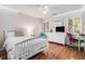 Bright bedroom with a white bed and furniture at 1600 Heritage Trl, Roswell, GA 30075