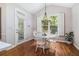 Cozy dining area featuring a white table set and ample natural light at 1600 Heritage Trl, Roswell, GA 30075