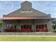Roswell Junction brick building with red doors and awnings at 1600 Heritage Trl, Roswell, GA 30075