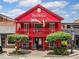 Mac McGee Restaurant with bright red exterior and second-floor balcony at 1600 Heritage Trl, Roswell, GA 30075