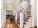 Spacious foyer featuring hardwood floors and a staircase leading to the second floor at 1600 Heritage Trl, Roswell, GA 30075