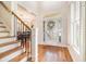 Grand foyer with hardwood floors, stairs, and an abundance of natural light at 1600 Heritage Trl, Roswell, GA 30075
