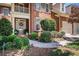 Inviting front entrance with decorative glass door and well-maintained landscaping at 1600 Heritage Trl, Roswell, GA 30075