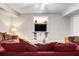 Living room featuring a custom entertainment center and comfortable, matching red sofas at 1600 Heritage Trl, Roswell, GA 30075