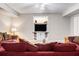 Cozy living room with plush seating, neutral walls, and built-in entertainment center for relaxation at 1600 Heritage Trl, Roswell, GA 30075