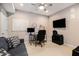 Dedicated office space with a desk, computer, television, and comfortable seating at 1600 Heritage Trl, Roswell, GA 30075