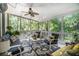 Relaxing screened porch featuring comfortable outdoor seating, ideal for enjoying the outdoors at 1600 Heritage Trl, Roswell, GA 30075