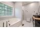 Bathroom boasts a soaking tub, walk-in shower, and dual sinks at 188 Cooper Creek Dr, Dallas, GA 30157