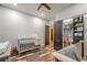 Charming Bedroom with gray crib, spacious closet, and wood-look flooring at 188 Cooper Creek Dr, Dallas, GA 30157