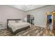 Comfortable bedroom featuring a walk-in closet and hardwood floors, providing ample storage at 188 Cooper Creek Dr, Dallas, GA 30157