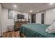 Bedroom with shiplap walls, wood floor, tv, and dresser at 188 Cooper Creek Dr, Dallas, GA 30157