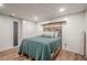 Rustic bedroom with wood floor, shiplap walls, and modern decor elements at 188 Cooper Creek Dr, Dallas, GA 30157