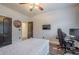 Bedroom with ceiling fan, wood-look floors, TV, and access to hallway at 188 Cooper Creek Dr, Dallas, GA 30157