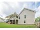 Exterior view of the home with a covered deck and a fenced backyard at 188 Cooper Creek Dr, Dallas, GA 30157