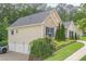 View of home exterior with a three car garage at 188 Cooper Creek Dr, Dallas, GA 30157