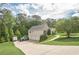 Inviting single-Gathering home featuring a three-car garage, a well-manicured lawn, and surrounded by mature trees at 188 Cooper Creek Dr, Dallas, GA 30157