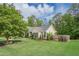 Charming home with a well-manicured front yard, mature trees, and blue shutters adding to its curb appeal at 188 Cooper Creek Dr, Dallas, GA 30157