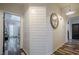 Hallway features shiplap walls, rustic decor, and wood-look floors at 188 Cooper Creek Dr, Dallas, GA 30157