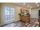 Bright and airy kitchen with granite countertops, wood cabinets, and views of the backyard, perfect for cooking at 188 Cooper Creek Dr, Dallas, GA 30157