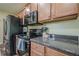 Close-up of kitchen showcasing stainless steel appliances and granite countertops, creating a functional space at 188 Cooper Creek Dr, Dallas, GA 30157