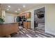 Open kitchen boasts wood cabinets, island, and a view to living room, creating an inviting space at 188 Cooper Creek Dr, Dallas, GA 30157