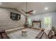 Spacious living room featuring a stone fireplace, vaulted ceilings, and cozy seating, creating a comfortable space at 188 Cooper Creek Dr, Dallas, GA 30157