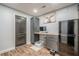 Finished basement office space with built in desk, refrigerator, and hard surface floors at 188 Cooper Creek Dr, Dallas, GA 30157