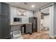 Finished basement office with built in desk and access to a bathroom with modern finishes at 188 Cooper Creek Dr, Dallas, GA 30157