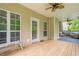 Covered porch area with ceiling fans and outdoor seating at 188 Cooper Creek Dr, Dallas, GA 30157