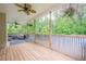 Spacious covered porch with ceiling fans and outdoor seating area at 188 Cooper Creek Dr, Dallas, GA 30157