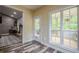 Sunlit sunroom with backyard access and ample windows, creating a seamless connection to the outdoors at 188 Cooper Creek Dr, Dallas, GA 30157