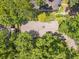 Overhead shot of the home surrounded by a dense forest at 4649 Dahlia Dr, Pine Lake, GA 30072