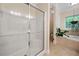 Bathroom with a glass-door shower, soaking tub, tiled floor, and ample space at 4649 Dahlia Dr, Pine Lake, GA 30072