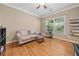 Bedroom featuring hardwood floors, natural lighting, and a ceiling fan at 4649 Dahlia Dr, Pine Lake, GA 30072