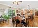 An open floor plan with a wooden table, chairs, and access to a kitchen at 4649 Dahlia Dr, Pine Lake, GA 30072