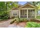 Charming craftsman home featuring a screened-in porch and beautiful landscaping at 4649 Dahlia Dr, Pine Lake, GA 30072