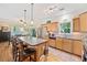 A spacious kitchen with a large island, stainless steel appliances, and light wood cabinets at 4649 Dahlia Dr, Pine Lake, GA 30072